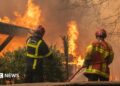 A firefighting crew deployed to battle a wildfire spreading in Lege-Cap-Ferret, south western France, late 24 July 2026.