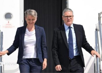 British Prime Minister Sir Keir Starmer (R) and British Foreign Secretary Yvette Cooper (L) disembark from a plane at Esenboga Airport ahead of the 2026 Nato summit in Ankara, 7 July