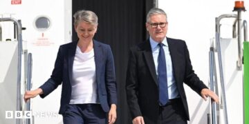 British Prime Minister Sir Keir Starmer (R) and British Foreign Secretary Yvette Cooper (L) disembark from a plane at Esenboga Airport ahead of the 2026 Nato summit in Ankara, 7 July