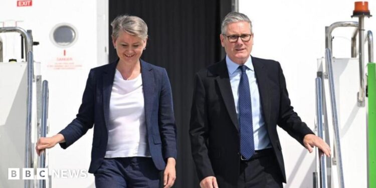 British Prime Minister Sir Keir Starmer (R) and British Foreign Secretary Yvette Cooper (L) disembark from a plane at Esenboga Airport ahead of the 2026 Nato summit in Ankara, 7 July