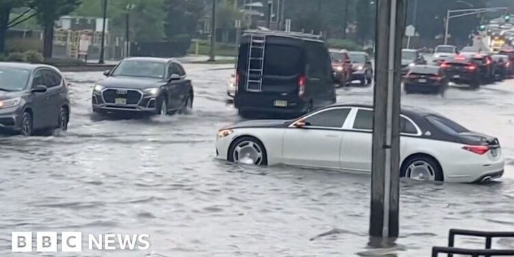 Car partially submerged in water.