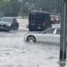 Car partially submerged in water.