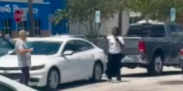 Bart Diguglielmo walks toward a woman holding what appears to be a cellphone in a Walmart parking lot before the fatal shooting in North Lauderdale, Florida.