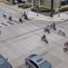 image shows e-bikers in an intersection