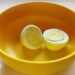 A boiled egg placed in a yellow plastic bowl