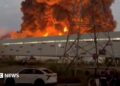 Smoke rises from a Wildberries warehouse on fire after an attack in Nevinnomyssk, Russia, July 22, 2026