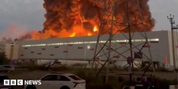 Smoke rises from a Wildberries warehouse on fire after an attack in Nevinnomyssk, Russia, July 22, 2026