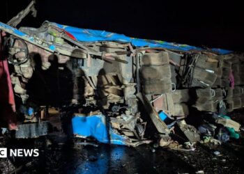 A wreckage of a bus from an accident
