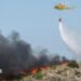 A helicopter works to extinguish flames amid deadly wildfires affecting Almeria province