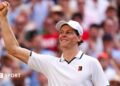 Jannik Sinner celebrates his victory over Novak Djokovic on Centre Court
