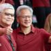 Jensen Huang, chief executive officer of Nvidia (right), poses for photographs with TSMC boss CC Wei smiling with their thumbs up. Both men are dressed in red polo t-shirts