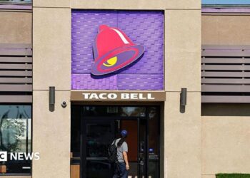 A person enters a Taco Bell restaurant on July 14, 2026 in Pasadena, California.