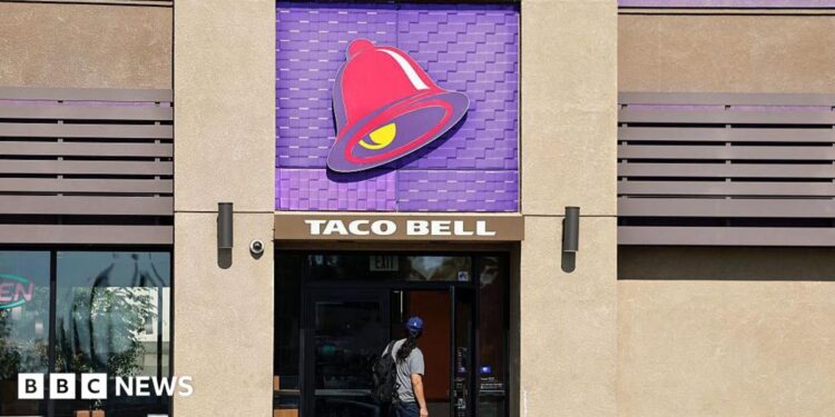A person enters a Taco Bell restaurant on July 14, 2026 in Pasadena, California.