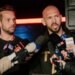 Andrew Tate talks to the media outside his residence in Bucharest, Romania.