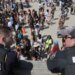 Police overlook a crowd at Orange Crush on Tybee Island on Saturday, April 19.