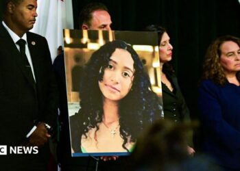 A portrait of the late Celeste Rivas Hernandez is shown during a press briefing by Los Angeles County District Attorney Nathan J. Hochman (out of frame) on the case against singer D4vd in Los Angeles, on April 20, 2026.