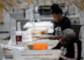 Fulton county workers process absentee ballots at ahead of the U.S, presidential election, in Atlanta