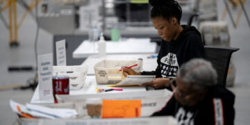Fulton county workers process absentee ballots at ahead of the U.S, presidential election, in Atlanta