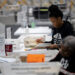 Fulton county workers process absentee ballots at ahead of the U.S, presidential election, in Atlanta