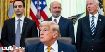 Michael Kratsios, director of the White House Office of Science and Technology Policy, from left, US President Donald Trump, Howard Lutnick, US commerce secretary, and Chris Wright, US energy secretary, during an executive order signing in the Oval Office of the White House in Washington, DC, US, on Monday, June 22, 2026.