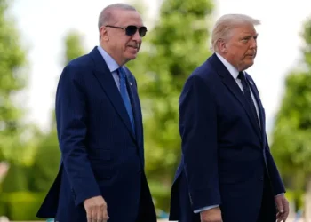 President Donald Trump poses with Turkish President Recep Tayyip Erdoğan ahead of the NATO summit.