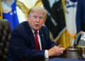 U.S. President Donald Trump signs an executive order in the Oval Office at the White House