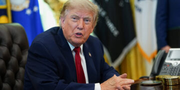U.S. President Donald Trump signs an executive order in the Oval Office at the White House