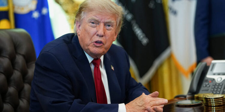 U.S. President Donald Trump signs an executive order in the Oval Office at the White House