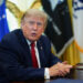 U.S. President Donald Trump signs an executive order in the Oval Office at the White House