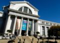 Smithsonian National Museum of American History building with large columns and tourists