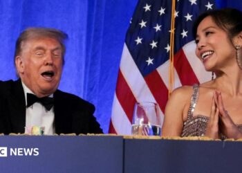 Trump reacts next to CBS News senior White House correspondent and White House Correspondents' Association President (WHCA) Weijia Jiang at the WHCA Dinner
