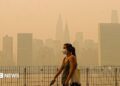Smoke from massive wildfires in Canada engulfed the New York City skyline, reducing visibility and casting an orange haze over the New York City
