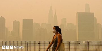 Smoke from massive wildfires in Canada engulfed the New York City skyline, reducing visibility and casting an orange haze over the New York City