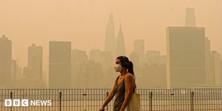 Smoke from massive wildfires in Canada engulfed the New York City skyline, reducing visibility and casting an orange haze over the New York City