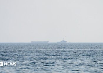 Vessels float in the Strait of Hormuz.