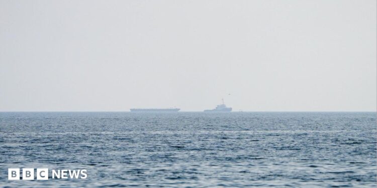 Vessels float in the Strait of Hormuz.