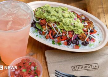 A chicken bowl from Chipotle with a drink and a dip.