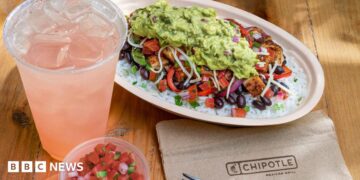 A chicken bowl from Chipotle with a drink and a dip.