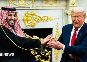 A file image of Saudi Crown Prince Mohammed bin Salman holding an extended handshake in the White House Oval Office with US President Donald Trump