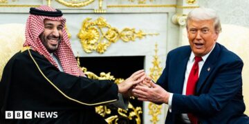 A file image of Saudi Crown Prince Mohammed bin Salman holding an extended handshake in the White House Oval Office with US President Donald Trump