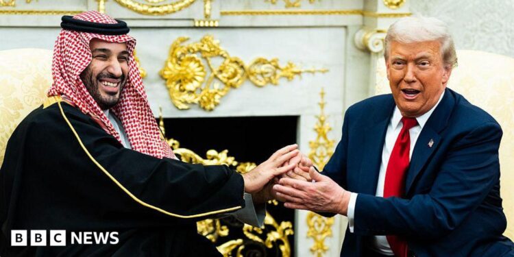 A file image of Saudi Crown Prince Mohammed bin Salman holding an extended handshake in the White House Oval Office with US President Donald Trump