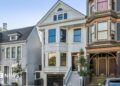 Three homes on a residential street in San Francisco. The three floor homes look clean and well maintained with well-trimmed plants and trees outside.