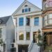 Three homes on a residential street in San Francisco. The three floor homes look clean and well maintained with well-trimmed plants and trees outside.