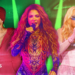 Picture of Justin Bieber in a red outfit singing into a microphone, Shakira in an embellished bodysuit singing into a microphone and Madonna in a pink corset singing into a microphone set against a green background.