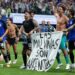 The Argentina players celebrate at full-time with a banner that reads "The Falkland Islands are Argentinian" during the World Cup 2026 semi-final between England and Argentina