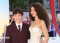 Tom Holland waving for cameras