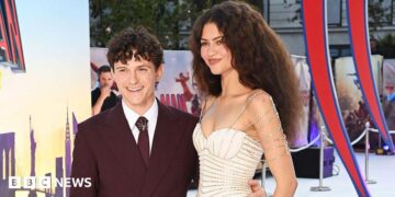 Tom Holland waving for cameras