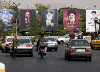 Banners with pictures of the late Supreme Leader of Iran, Ayatollah Ali Khamenei, are displayed on a street in Tehran