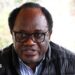 Zambian opposition leader and National Reconciliation Party for Unity Brian Mundubile in a black coat and stripped blue-white shirt
