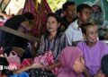 Villagers rest in a tent in an open field in East Nusa Tenggara